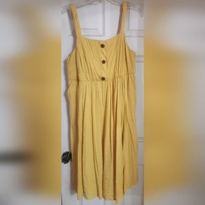 NWOT Torrid yellow knee length midi dress size 2. Never worn